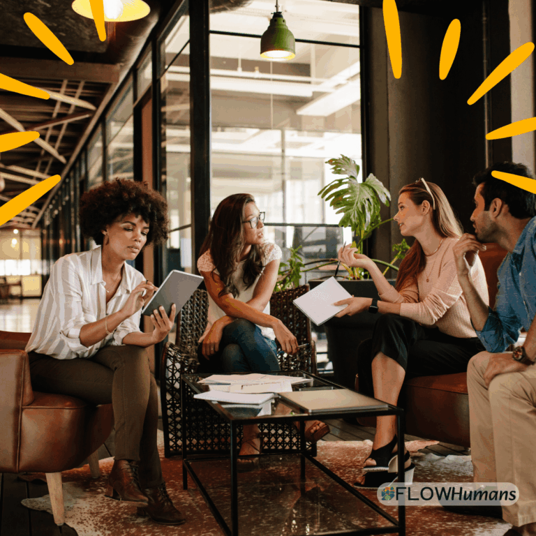 Équipe en réunion de travail échangeant autour d’un projet illustrant la performance collective et la communication en entreprise